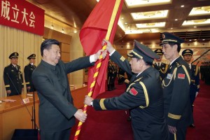 (160101) -- BEIJING, Jan. 1, 2016 (Xinhua) -- Chinese President Xi Jinping (L F) confers the military flag to Wei Fenghe (C F), commander of the Rocket Force of the Chinese People's Liberation Army (PLA), and Wang Jiasheng (R F), political commissar of the Rocket Force, in Beijing, capital of China, Dec. 31, 2015. The general commands of the PLA Army, Rocket Force and Strategic Support Force were founded on Thursday. (Xinhua/Li Gang) (zwx)