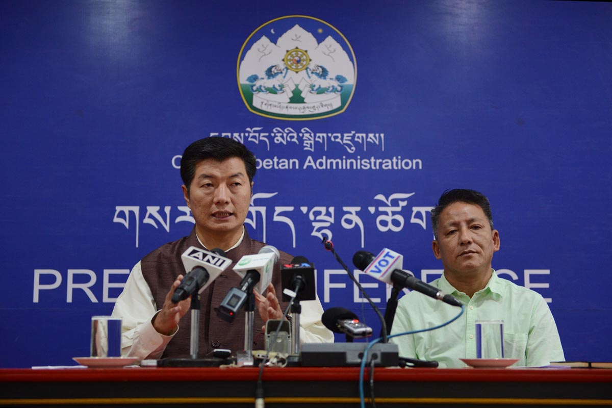 Sikyong Lobsang Sangay speaks during a press conference, as Finance Minister of the Central Tibetan Administration, Karma Yeshi, look on, in Dharamshala, India, on 3 October 2016.